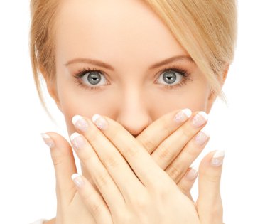 Amazed woman with hand over mouth clipart
