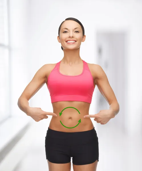 Woman with arrows on her stomach — Stock Photo, Image