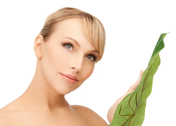 Woman with green leaf — Stock Photo, Image