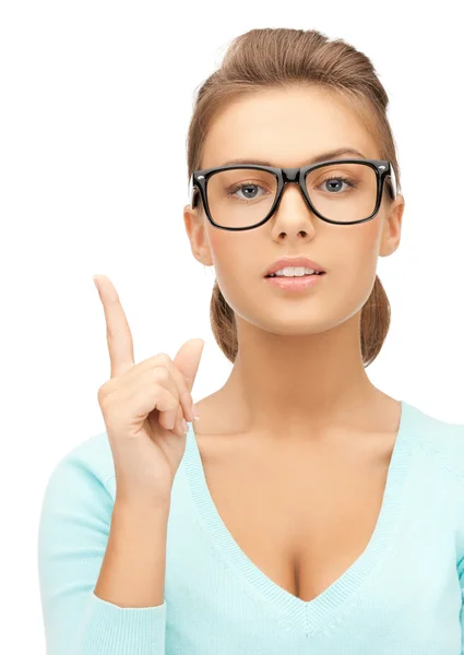 Woman in glasses with finger up Stock Picture