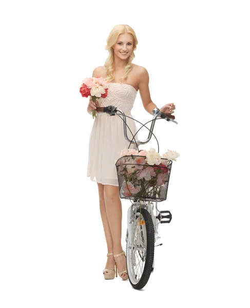 Country girl with bicycle and flowers Stock Image