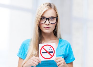 Woman with smoking restriction sign clipart