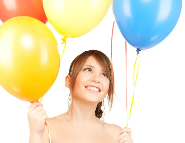 Menina feliz com balões coloridos — Fotografia de Stock