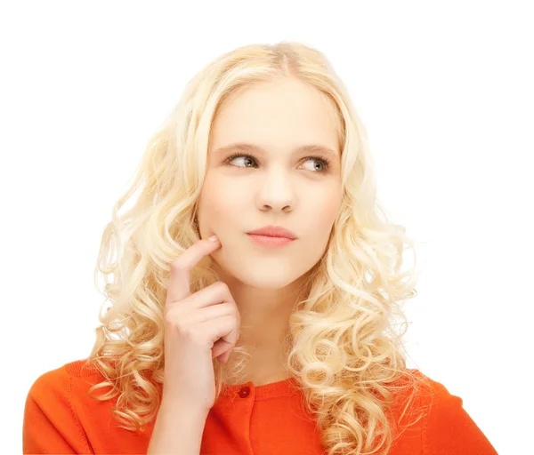 Girl thinking with finger on her cheek — Stock Photo, Image