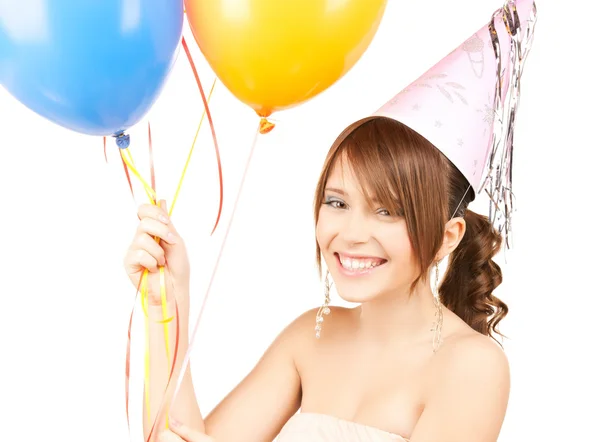 Happy girl with colorful balloons Stock Picture
