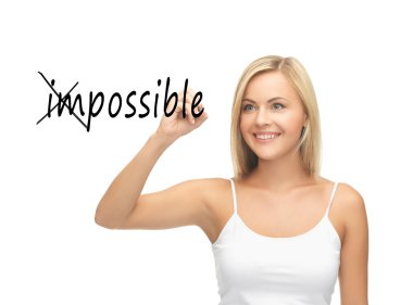 Woman writing the word (im)possible in the air clipart