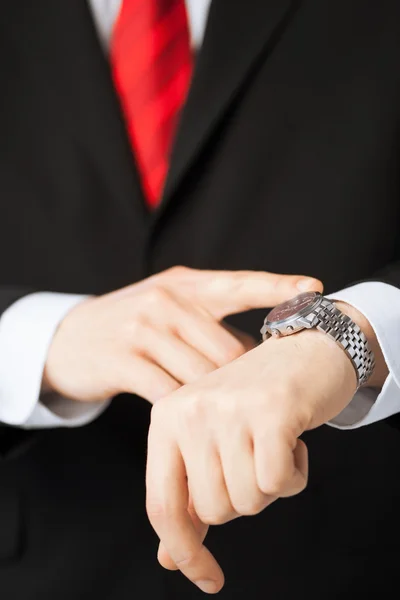 Man looking at wristwatch — Stock Photo, Image