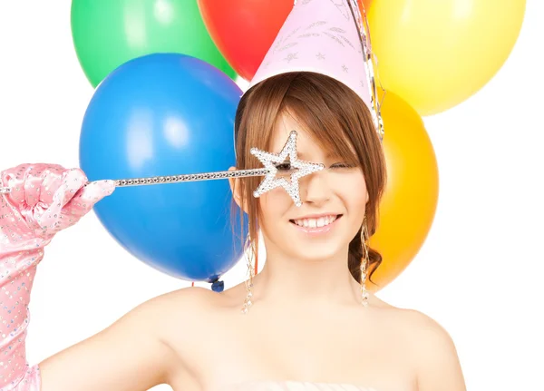 Gelukkig meisje met kleurrijke ballonnen Stockfoto