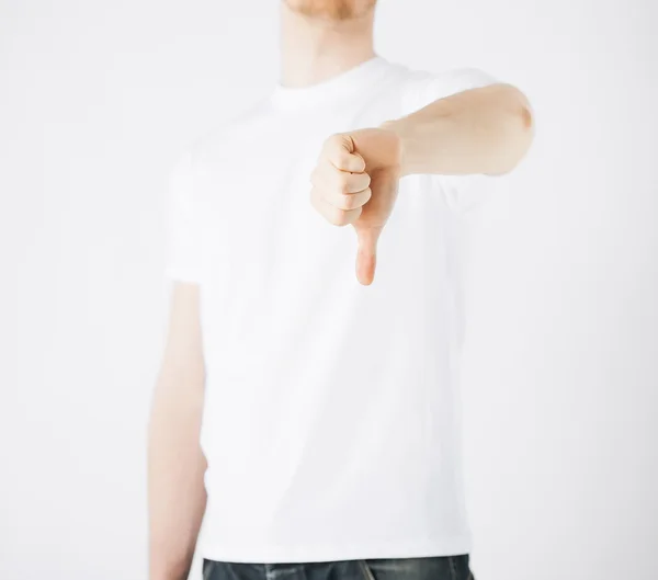 Man showing thumbs down — Stock Photo, Image