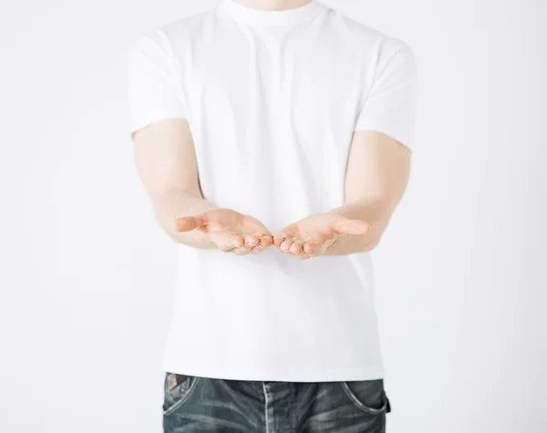 Mans hands showing something — Stock Photo, Image