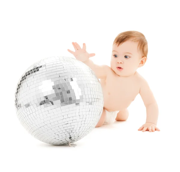 Child playing with disco ball — Stock Photo, Image