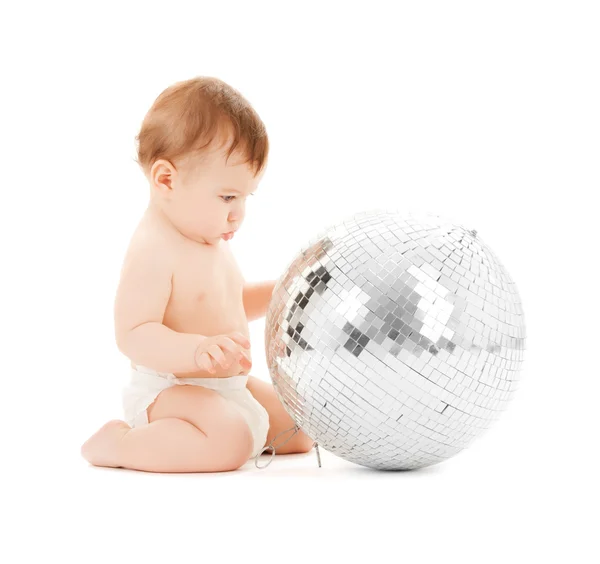 Child playing with disco ball — Stock Photo, Image