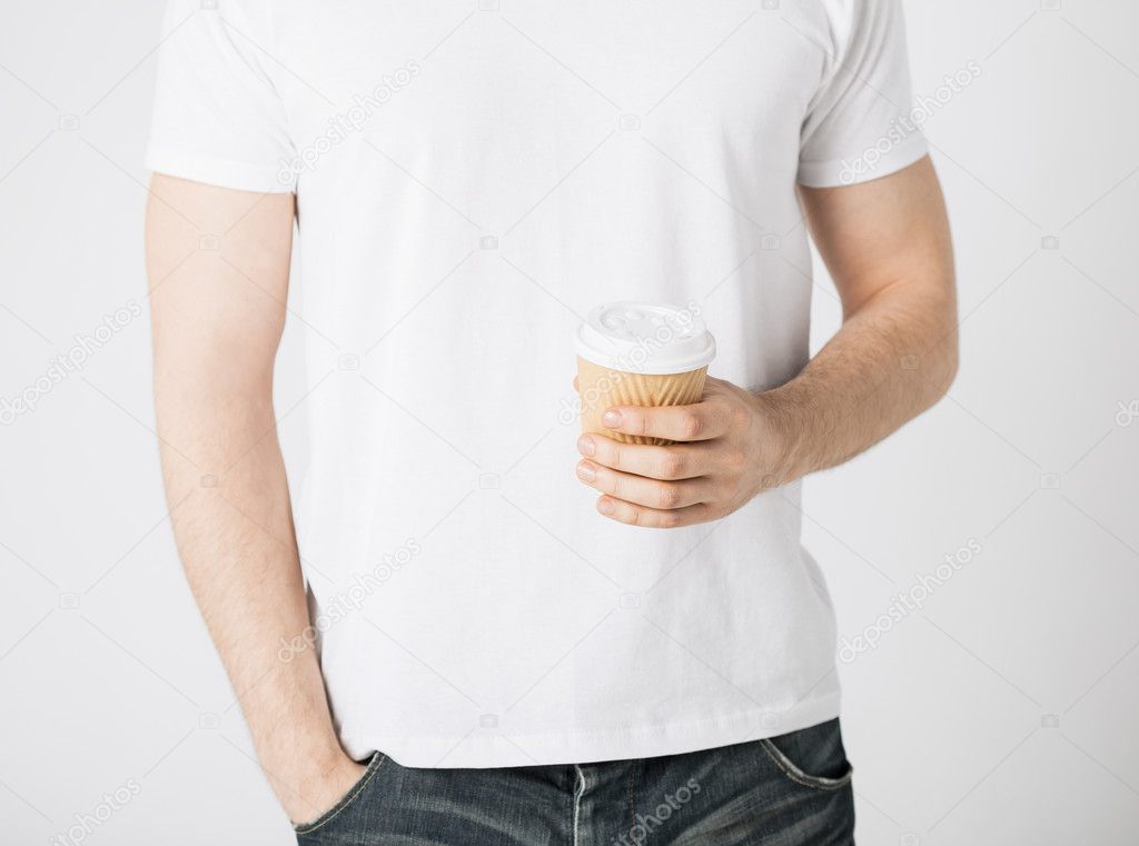 Man hand holding take away coffee cup