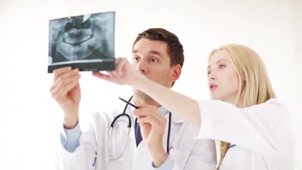 Closeup of two doctors with x-ray prints — Stock Video