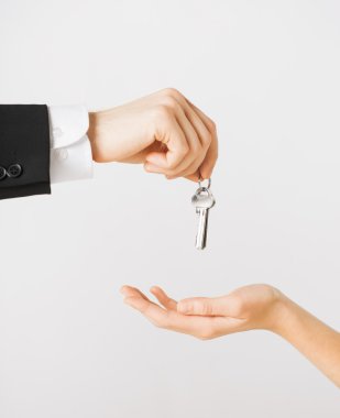 Man and woman with house keys clipart