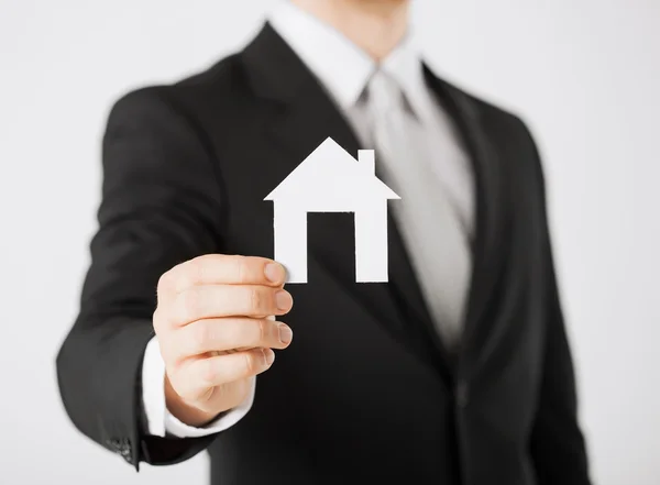 Man hand holding paper house — Stock Photo, Image