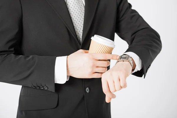 Man looking at wristwatch — Stock Photo, Image