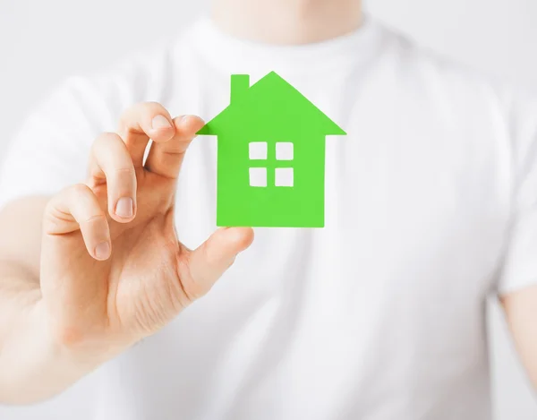 Hand holding green house — Stock Photo, Image