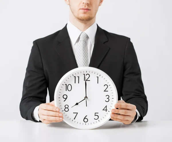 Man with wall clock — Stock Photo, Image