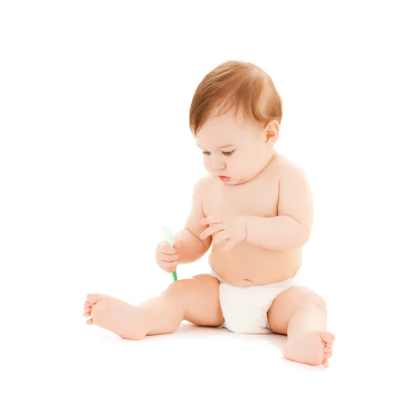 Curious baby brushing teeth — Stock Photo, Image