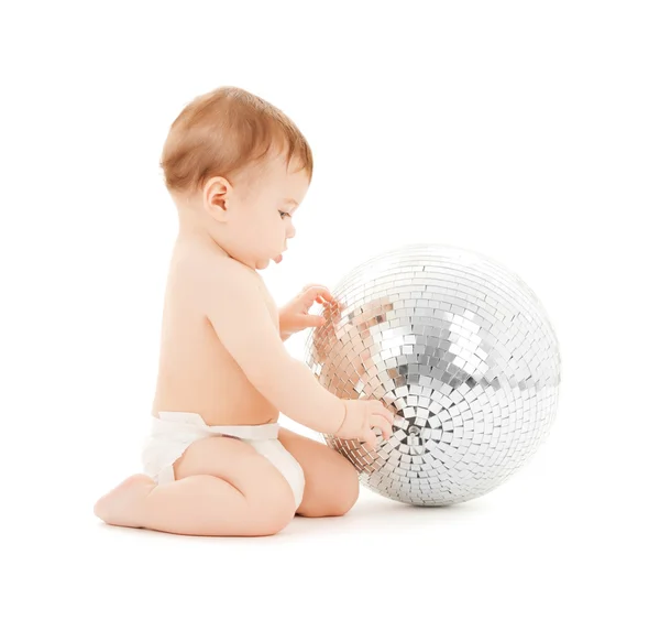 Child playing with disco ball — Stock Photo, Image