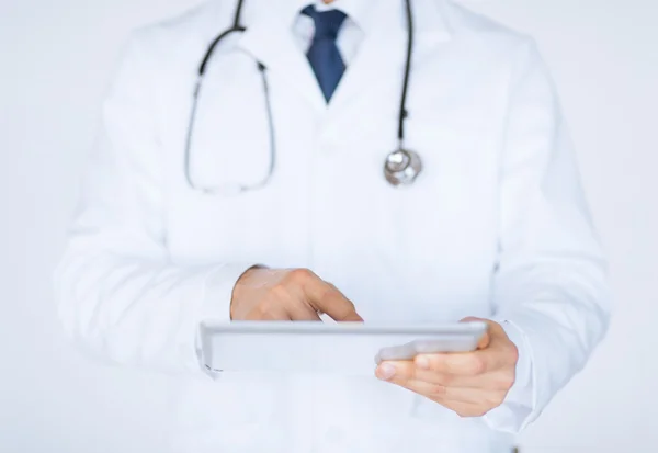 Male doctor holding tablet pc — Stock Photo, Image