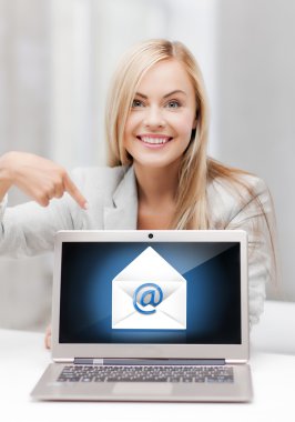 Woman with laptop pointing at email sign clipart