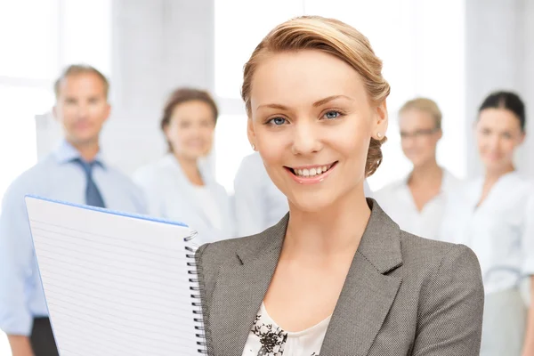 Happy woman with big notepad — Stock Photo, Image