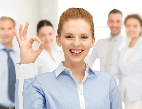Young woman showing ok sign Stock Picture