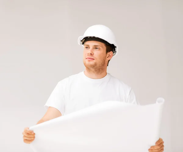 Male architect looking at blueprint — Stock Photo, Image