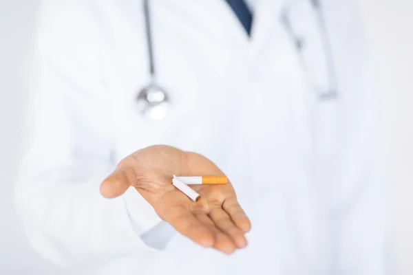 Man breaking the cigarette with hands — Stock Photo, Image