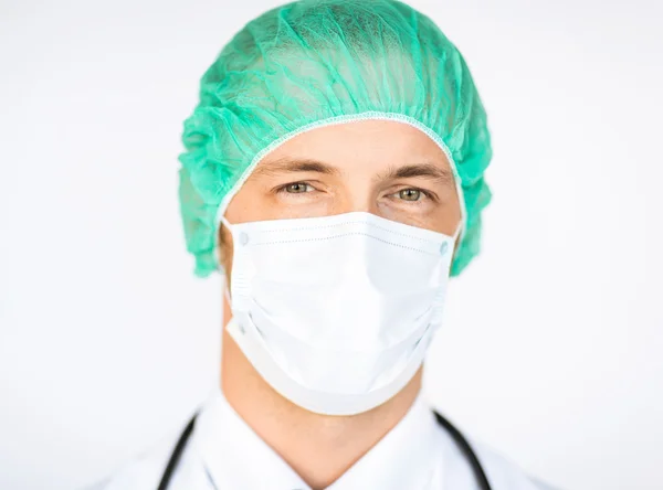 Surgeon in medical cap and mask — Stock Photo, Image