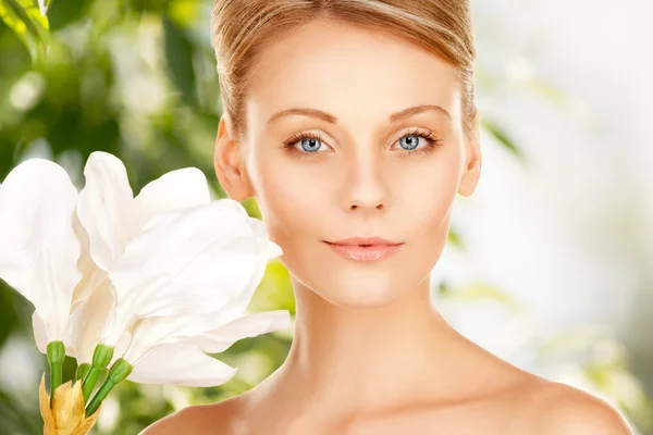 Beautiful woman with madonna lily — Stock Photo, Image