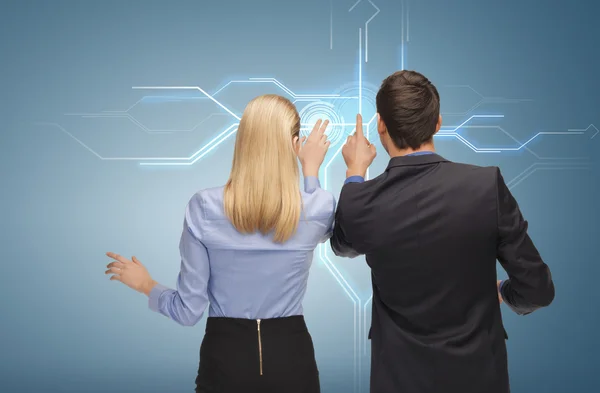 Man and woman working with virtual screen — Stock Photo, Image