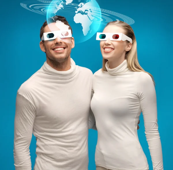 Woman and man in 3d glasses looking at globe model — Stock Photo, Image