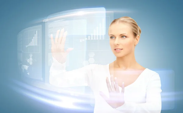 Businesswoman touching virtual screen — Stock Photo, Image