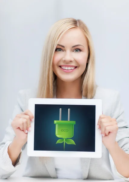 Woman with tablet pc with electrical eco plug — Stock Photo, Image