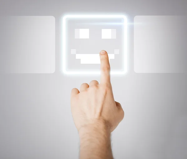 Hand touching virtual screen with smile button — Stock Photo, Image