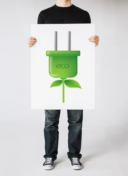 Manos sosteniendo imagen de enchufe verde ecol electrica — Foto de Stock