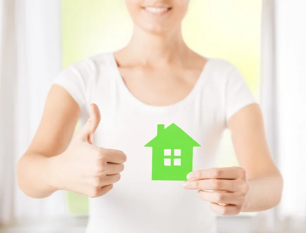 Woman hands holding green house — Stock Photo, Image