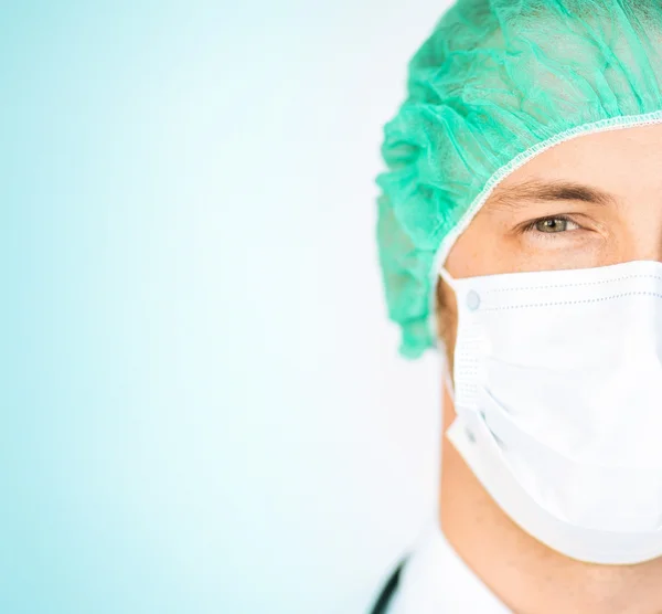 Surgeon in medical cap and mask — Stock Photo, Image