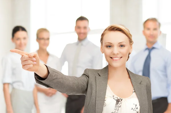 Businesswoman pointing her finger — Stock Photo, Image