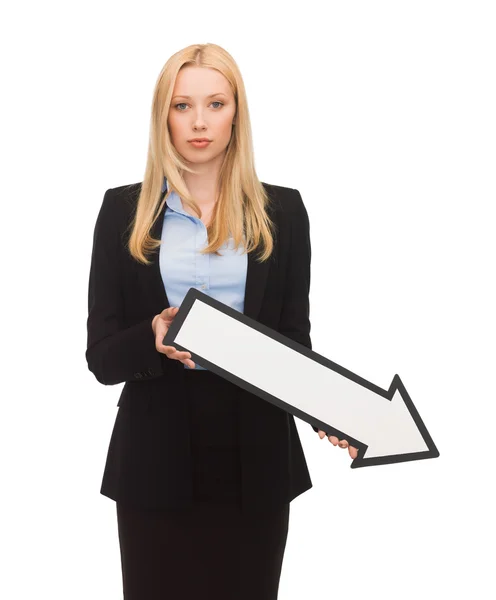 Smiling businesswoman with direction arrow sign — Stock Photo, Image