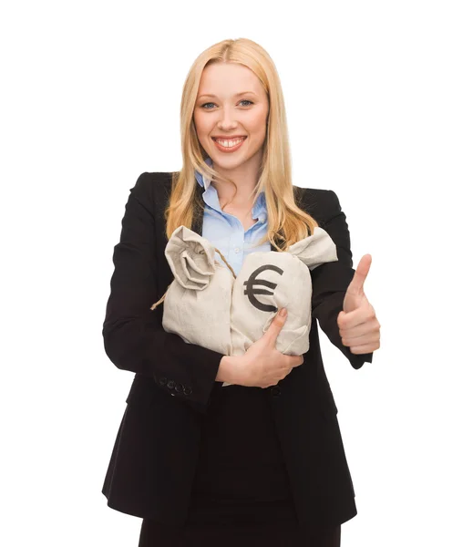 Businesswoman with money bags showing thumbs up — Stock Photo, Image