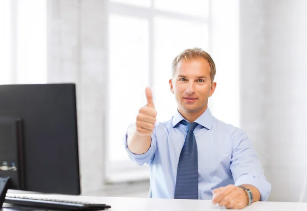 Smiling businessman showing thumbs up — Stock Photo, Image