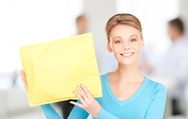 Businesswoman with parcel — Stock Photo, Image