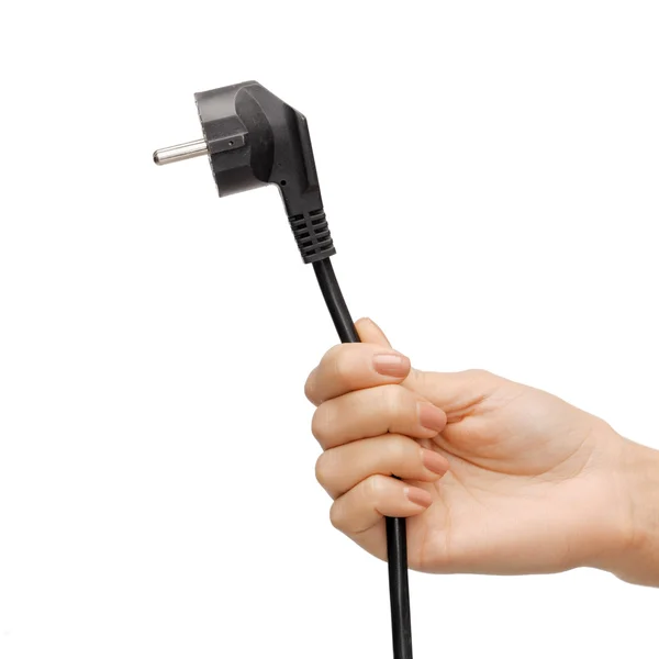 Hand holding black electrical plug with wire — Stock Photo, Image