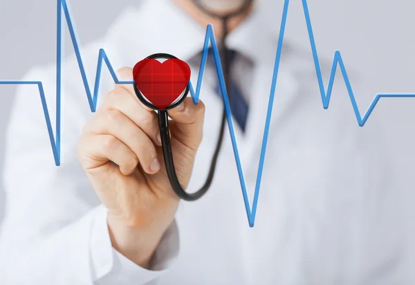 Doctor listening to heart beat — Stock Photo, Image