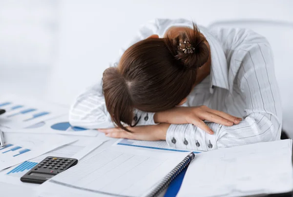 Tired woman sleeping at work — Stok fotoğraf