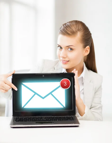 Businesswoman with laptop in office — Stock Photo, Image